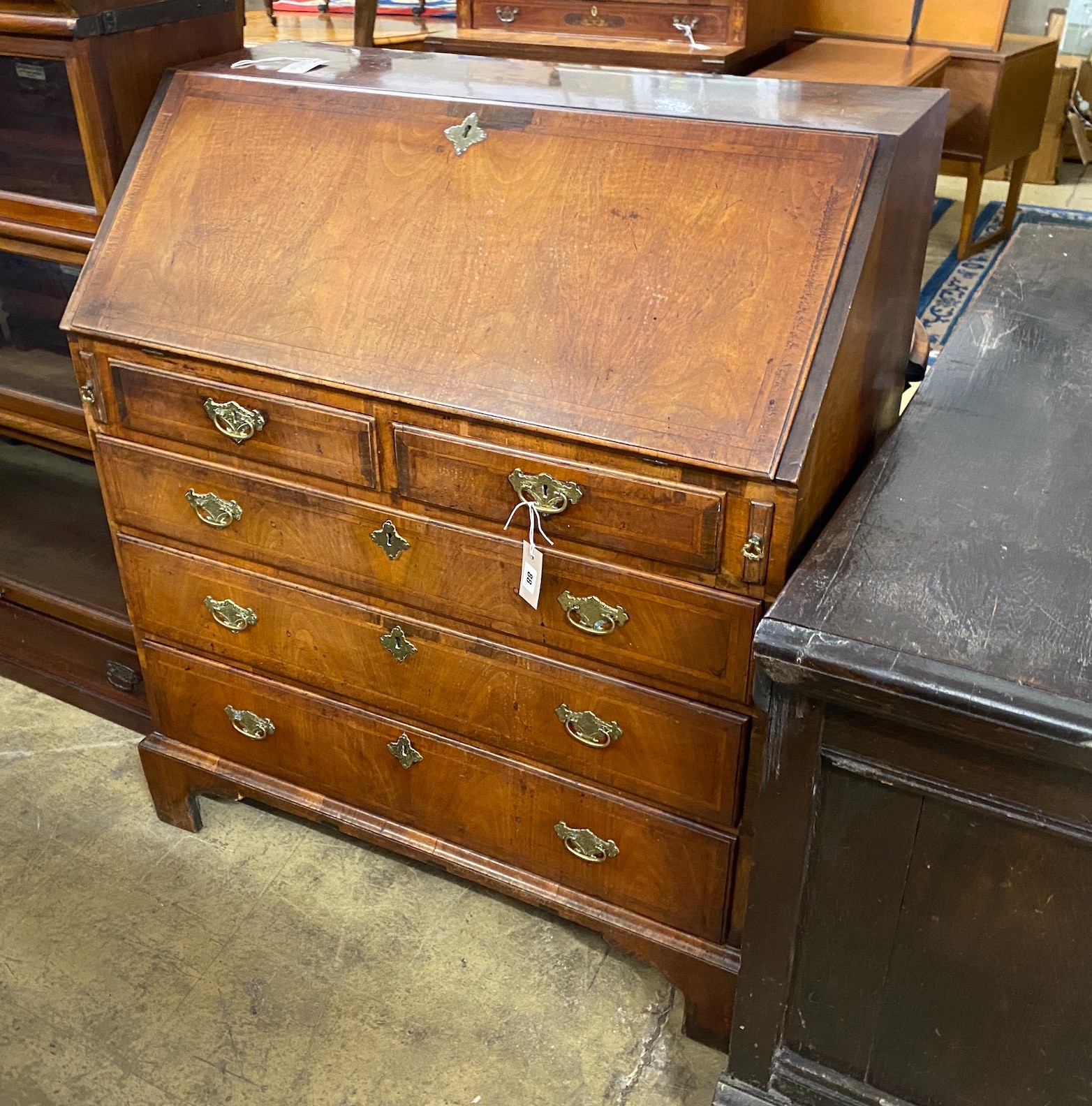 An 18th century feather banded walnut bureau, width 92cm, depth 51cm, height 108cm